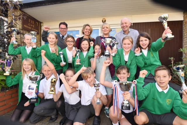 Eye C of E primary school receives Good OFSTED pictured are pupuils with some of the trophies they have won last school year with head teacher Jason Webster, deputy head Katie Wilson and governors Michelle O'Neill and Andy Godsell EMN-160928-140627009