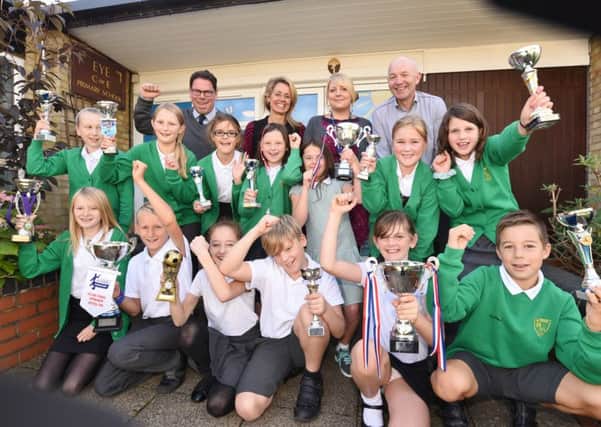 Eye C of E  primary school  receives Good OFSTED pictured are pupuils with some of the trophies they have won last school year with head teacher Jason Webster, deputy head Katie Wilson and governors Michelle O'Neill and Andy Godsell EMN-160928-140627009