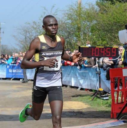 Josphat Kemei wins the Wilmslow Half-Marathon.