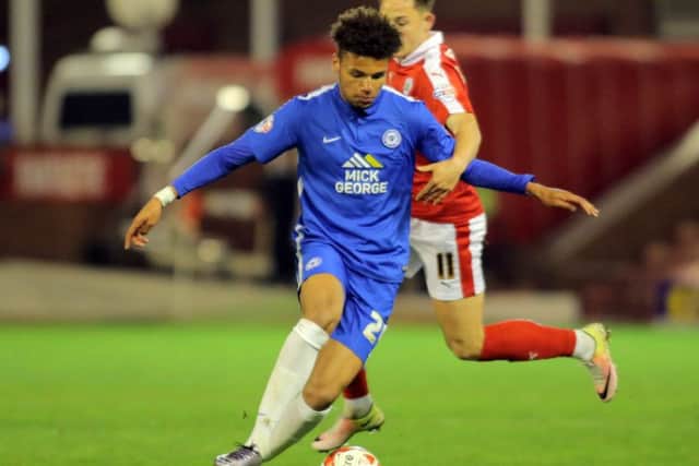 Lee Angol in action for Posh against Barnsley last season. Photo: Joe Dent/theposh.com.