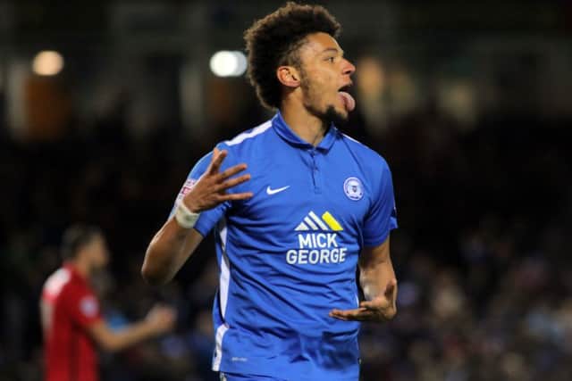 Lee Angol celebrates scoring for Posh. Photo: Joe Dent/theposh.com.
