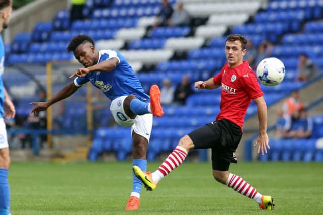 Northampton Town's Gaby Zakuani is expecting a tough tussle against Posh striker Shaquile Coulthirst (pictured). Photo: Joe Dent/theposh.com.