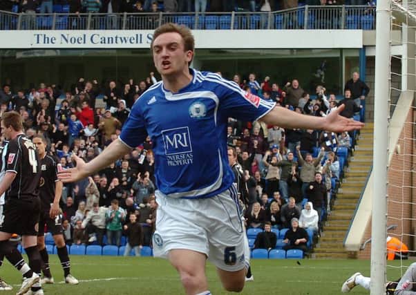 Charlie Lee celebrates the winning goal for Posh against Northampton in their last Football League meeting.