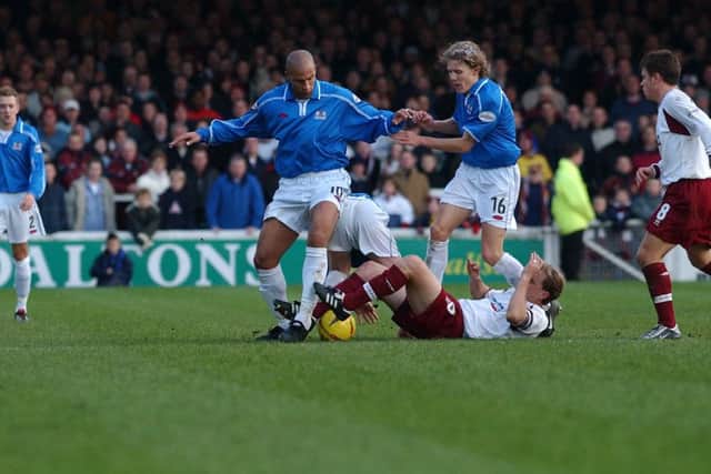 Jason Lee (left) and Jimmy Bullard in action for Posh against Northamton at London Road in 2001. Posh won this game 2-0.
