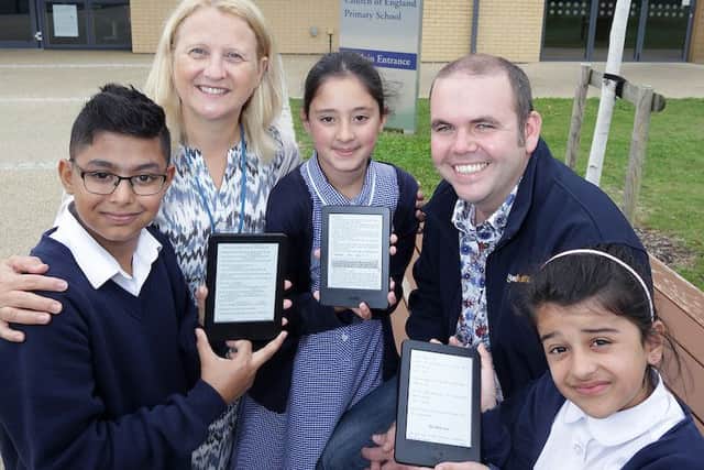 Saif (10), Headteacher Rachael Hutchinson, Zineerah (9), Kevin Bayliss (Amazon) and Anya (8.)