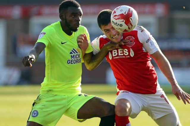 Posh full-back Hayden White battles for possession with Bobby Grant of Fleetwood. Photo: Joe Dent/theposh.com.