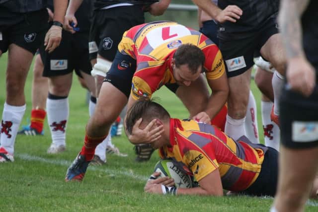 Borough celebrate a try againts Rugby Lions.
