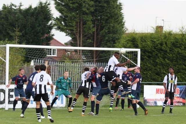 Wilkins Makate leaps highest for Peterborough Northern Star in their 2-0 home defeat by ON Chenecks. Photo: Tim Gates.