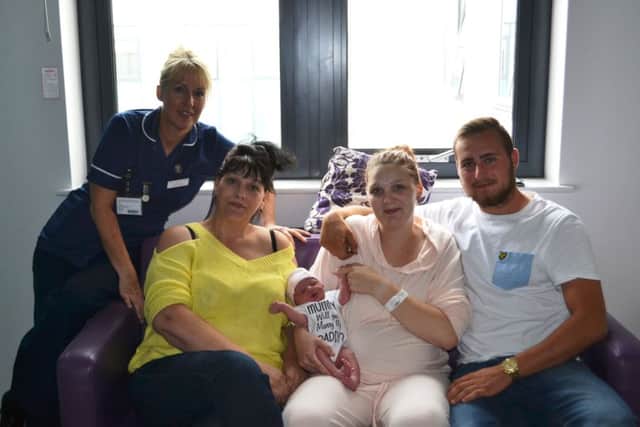 Midwife, Janine Kettle  left, with Laurens mum, Beverley Fovargue, and the happy trio