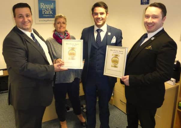 Regal Park Property Company managing director James Trigg, centre, with his team and their awards.