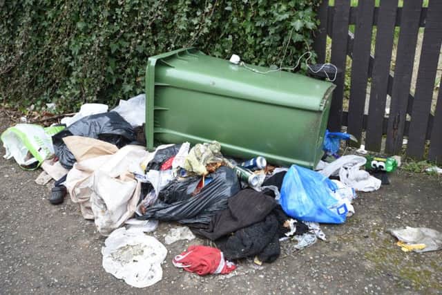 Litter around GN Cottages at Millfield. EMN-160318-180320009