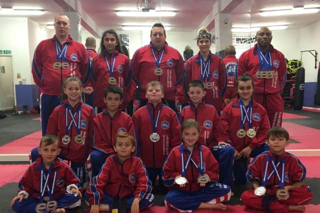 The Hicks Karate School students who did well at the World Championships. From the left they are, back, David Cairns, Elise Ward, Sensei Andrew Hicks (chief instructor), Atlanta Hickman (instructor), Rob Taylor, middle, Jolie Franks, Braydon Popat-Evans, Warren Bothamley, Aaron Leonard, Jazmyn Popat-Evans, front, Junior Crozier, Ginge Popat-Evans, Lucy Hicks and Denas Jankauskas.