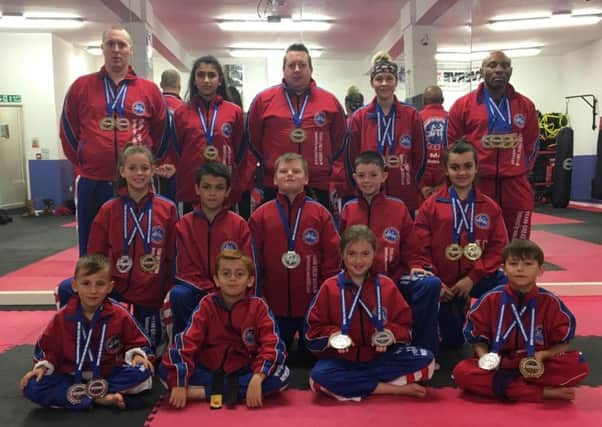 The Hicks Karate School students who did well at the World Championships. From the left they are, back, David Cairns, Elise Ward, Sensei Andrew Hicks (chief instructor), Atlanta Hickman (instructor), Rob Taylor, middle, Jolie Franks, Braydon Popat-Evans, Warren Bothamley, Aaron Leonard, Jazmyn Popat-Evans, front, Junior Crozier, Ginge Popat-Evans, Lucy Hicks and Denas Jankauskas.