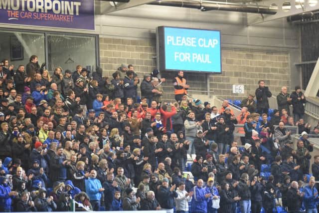 Posh v Northampton action at London Road. Crowd applaud Paul McCann who died during the GER EMN-161019-000820009