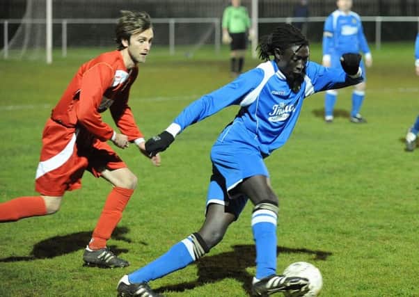 Ali Nyang (blue) scored for Peterborough Sports Reserves against Holbeach United Reserves.
