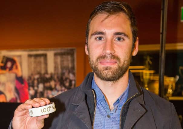 James Ferrara post game with the traditional celebratory puck to mark his 100th goal for the Phantoms. Picture: Tom Scott