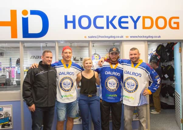 Kim Lane pictured at the recent opening of Hockey Dog along with, from the left, Jason Buckman, Janis Auzins, Scott Robson and Ales Padelek.