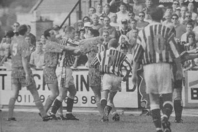 A difference of opinion between Ken Charlery and Bristol's Peter Beadle sparks off a bout of pushing and shoving.