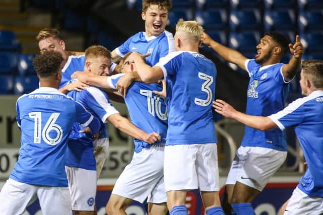 Alfie Connor celebrates scoring with team-mates. Picture: Joe Dent