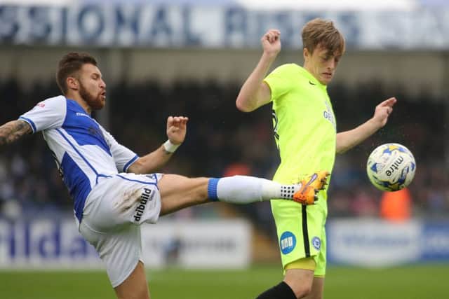 Posh skipper Chris Forrester battles with Matty Taylor of Bristol Rovers. Photo: Joe Dent/theposh.com.