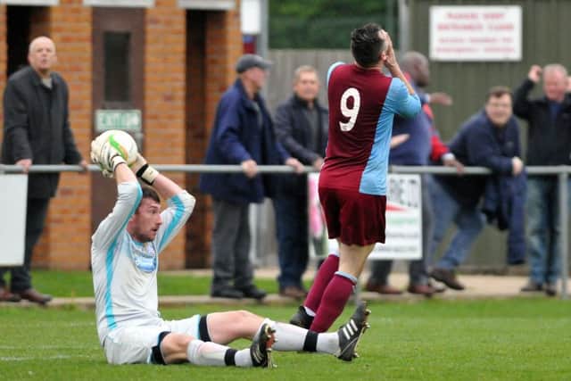 Deeping Rangers have just been denied a goal by the Desborough goalkeeper. Photo: Tim Wilson.