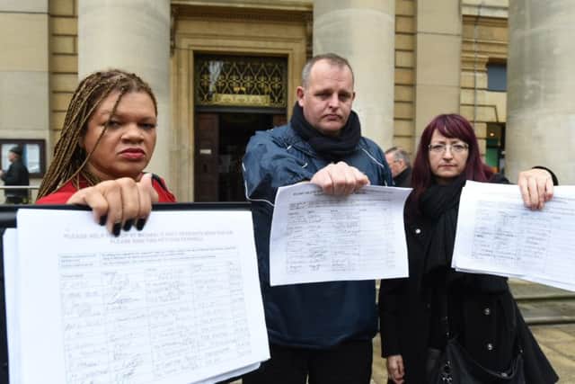 Julia Davidson, Darren Fower and Jelana Stevic handing in their petition to Peterborough City Council against the St Michael's Gate evictions