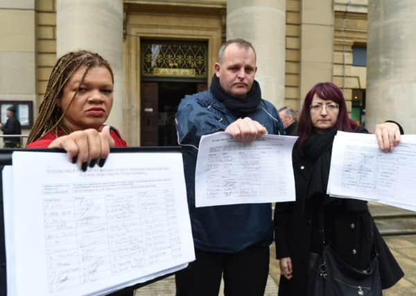 Julia Davidson, Darren Fower and Jelana Stevic handing in their petition to Peterborough City Council against the St Michael's Gate evictions