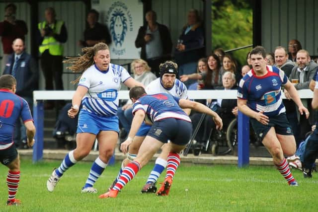 Sam Crooks attacks for the Lions. Levan Stapleton is in support. Picture: Mick Sutterby