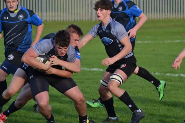 Lock forward Tyler Bibby in possession for Peterborough Regional College against Oaklands.
