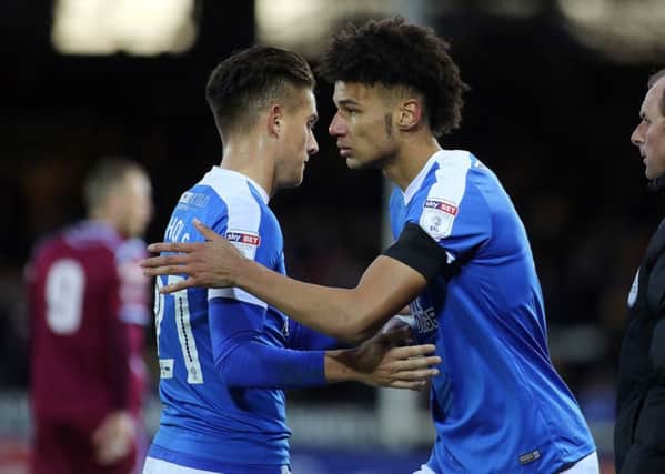 Lee Angol (right) makes his first Posh appearance of the season as a second-half substitute for Tom Nichols. Photo: Joe Dent/theposh.com.