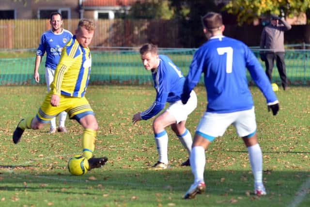 Billy King is about to open the scoring for Moulton Harrox against ICA Sports. Photo: Tim Wilson.
