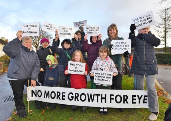 Local residents protest outside Eye primary school against proposed development in the village EMN-160711-160105009