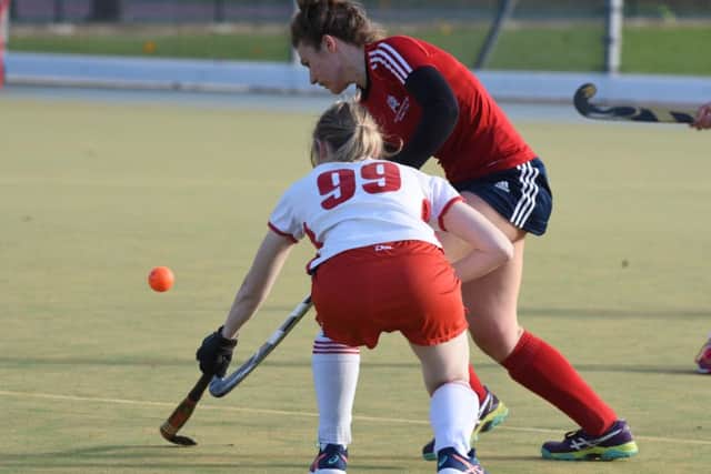 Action from City of Peterborough Ladies' fine win over Dereham. City are in red. Photo: David Lowndes.
