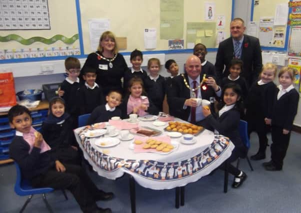 Children from Gladstone Primary School invited the deputy mayor and mayoress along to tea at the school. Pictured is also interim headteacher Simon Martin. ANL-161111-104844001