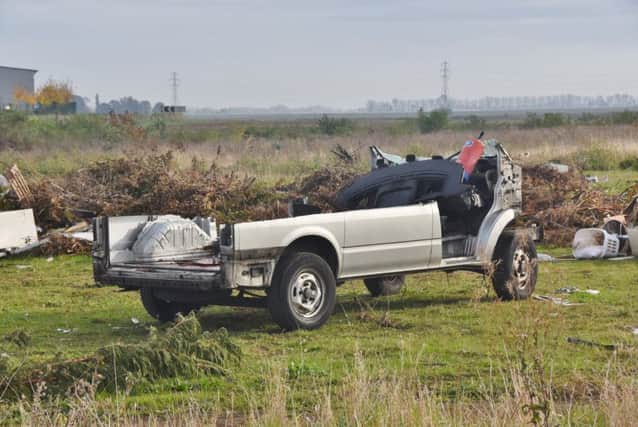 Burnt out cars etc at field next to the  Oxney Road travellers site EMN-160411-160537009