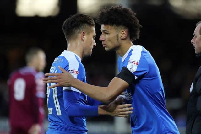 Posh striker Lee Angol (right) returns to action by replacing Tom Nichols during the FA Cup tie with Chesham. Photo: Joe Dent/theposh.com.