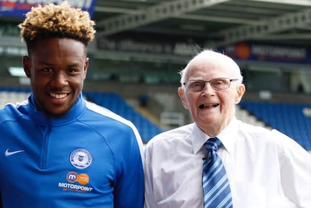 Lifelong Posh fan Eric Heath (right) with a club Academy graduate Jermaine Anderson.