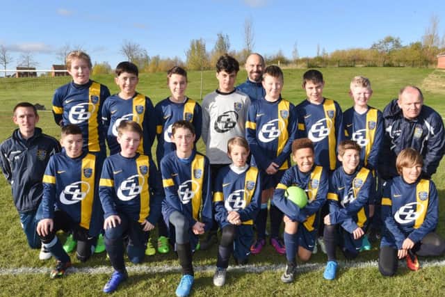 Glinton & Northborough Black Under 13s are pictured before a 1-0 PFA Cup defeat by Hampton Blue. From the left are, back, Joe Atkins, Matt Row, Josh Marshall, Oliver Priestley, Kev Hughes (coach), Ben Brittain, Joseph Hughes , Daniel Martin, Frank Martin (coach), front, Stephen Bull (manager), Vinnie Ball, Ollie Wooley, Dylan Phillips, Kyle Bull, Jose Mason-Baxter, Gytis Palacionis and Jude Hinch .