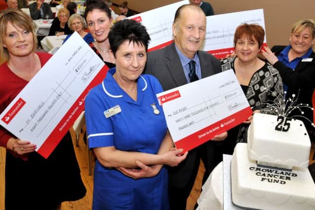 CHARITY CHAMPION: Frank Barrett, chairman of Crowland Cancer Fund, with Nikki Allen of St Barnabas Hospice, Charlotte Jackson of Marie Curie Cancer Care, Judith Anderson of Teenage Cancer Trust, (front) Jo Marriott and Andrea Cooper of Sue Ryder.  Photo by Tim Wilson.