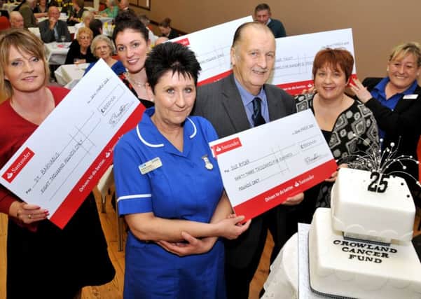 CHARITY CHAMPION: Frank Barrett, chairman of Crowland Cancer Fund, with Nikki Allen of St Barnabas Hospice, Charlotte Jackson of Marie Curie Cancer Care, Judith Anderson of Teenage Cancer Trust, (front) Jo Marriott and Andrea Cooper of Sue Ryder.  Photo by Tim Wilson.
