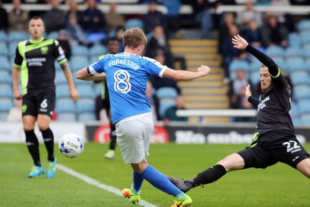 Chris Forrester scores for Posh against Bury.
