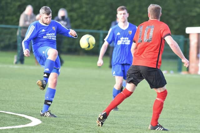 AFC Stanground Sports (blue) were beaten at home by Pinchbeck United. Photo: David Lowndes.