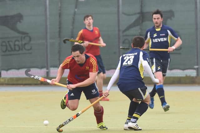 Action from City of Peterborough (red) against Ipswich. Photo: David Lowndes.