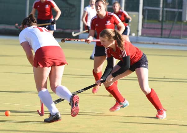 Di Bevan (red) created the first goal for City of Peterborough Ladies at Norwich Dragons.