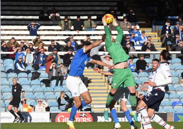 Former Posh goalkeeper Ben Alwnick claims a catch for Bolton. Photo: David Lowndes.