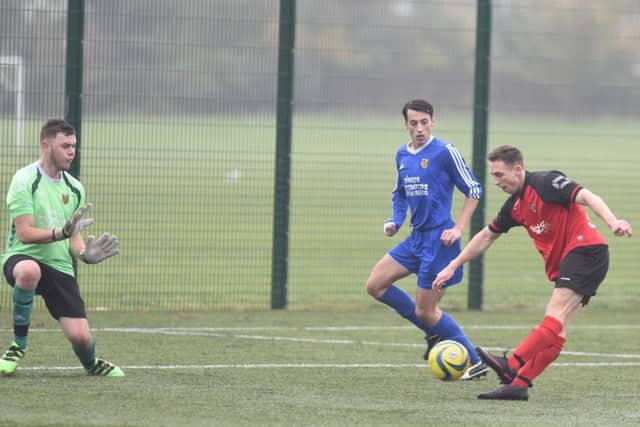 Netherton's Tom Randall shoots at goal during the 12-1 win over AFC Stanground Sports. Photo: David Lowndes.