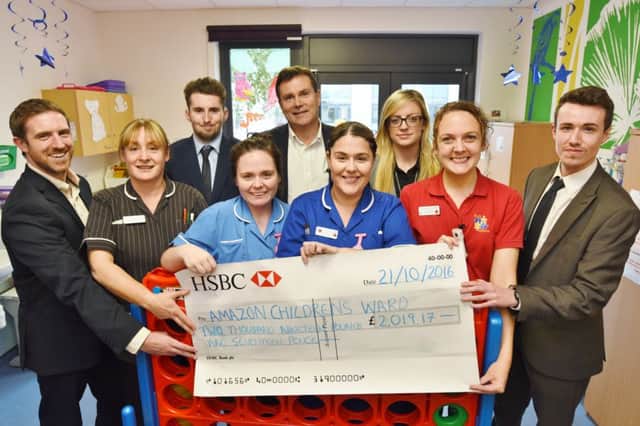 Henderson Brown Recruitment staff  Alex Marshall, Danny Banks, Martin Brown, Bronagh Doherty and  Ryan Peters presenting a cheque to Amazon Ward staff Anna Aughton, Katie Richardson, Hayley Charlton and Stacey Slater. EMN-161021-180704009
