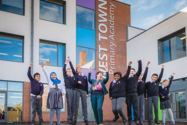 Principal Jane Dooley with pupils at the new building