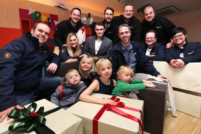 ©Tim George / UNP 0845 600 7737 Front row (L to R) Lee Shepherd, sisters Amelia (8) and Imogen (7), Jack Cook (Little Miracles), Kevin Bayliss and Baiba Ozola