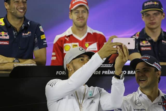 Lewis Hamilton takes a selfie of other Formula One drives including Max Verstappen (back right).